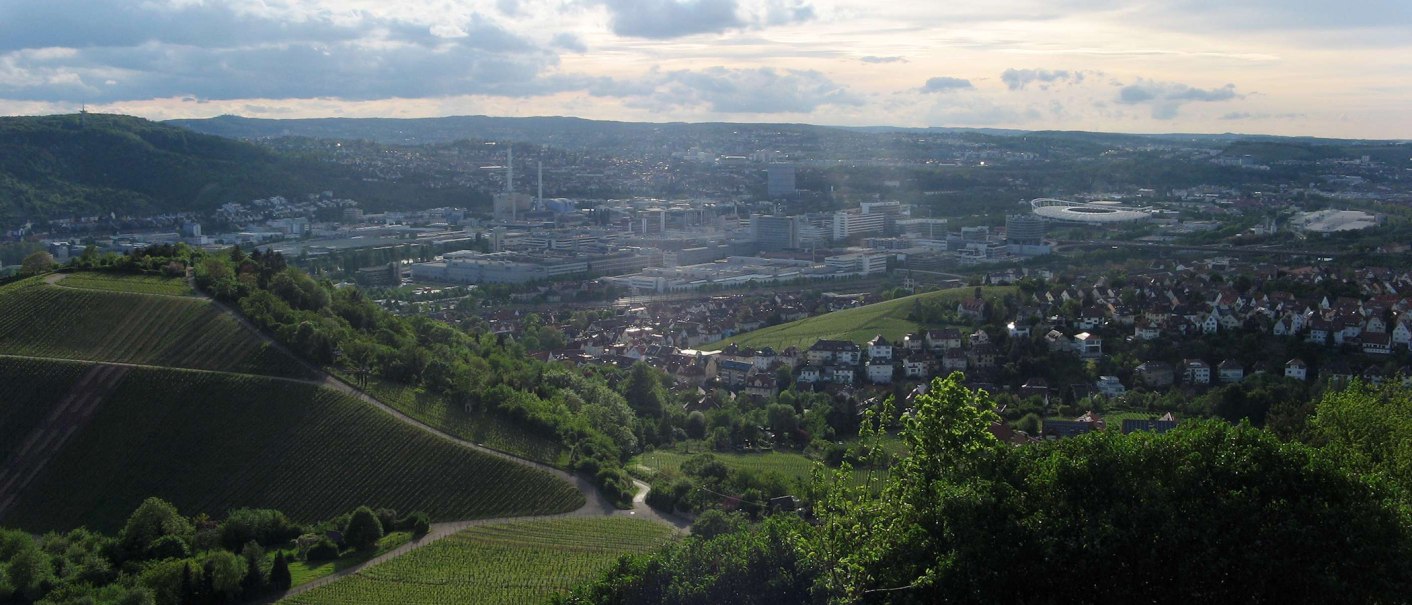 Panoramic view of Untert&uuml;rkheim: vineyards in the foreground, town and industrial buildings in the background under a cloudy sky., &copy; Stuttgart-Marketing GmbH