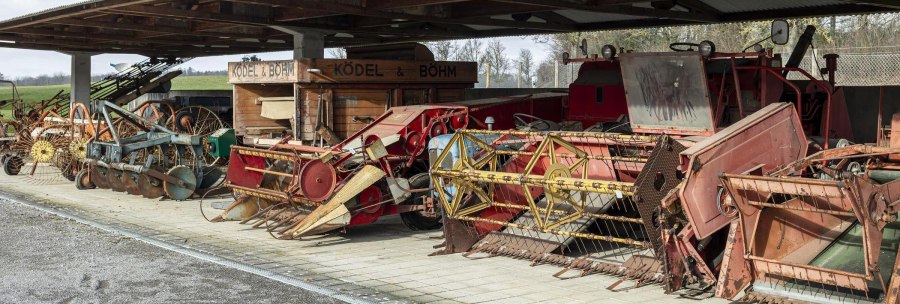 Historical agricultural machinery and equipment under a covered outdoor area, exhibited in the German Agricultural Museum., © Stuttgart Marketing GmbH, Sarah Schmid