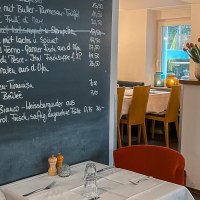 Restaurant with a set menu and laid tables. Candles and flowers create a cozy atmosphere., &copy; Little Italy, Stuttgart